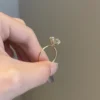 Brilliant round engagement ring featuring rounded claws and prong setting