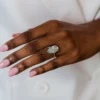 Pear cut diamond engagement ring with pave setting