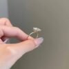 Round cut diamond engagement ring with classic solitaire styling and gold plating