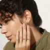 Elegant sterling silver hoop earrings with a polished gold finish