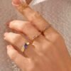 Amethyst-toned stone ring with delicate nature-inspired design