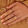 Gold-plated ring with structured Art Deco-inspired design