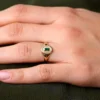 925 Silver signet ring with a baguette-set emerald-hued centre stone