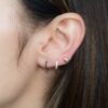 Huggie earrings with black cubic zirconia stones in pave setting