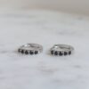 Gold plated sterling silver huggie earrings with black stone detail