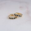 Snug huggie earrings featuring a simple modern hoop shape