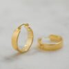 Smooth sterling silver hoop earrings with a substantial shape