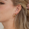 Chunky sterling silver hoop earrings with a rounded tube profile