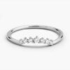 Curved wedding ring with pave-set CZ accents and clean design
