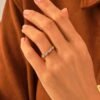 Low-profile ring with symmetrical baguette and round-cut design