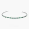 Classic tennis bracelet design with sparkling CZ diamond and emerald details