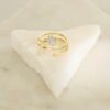 Open spiral ring with bezel-set premium CZ diamonds