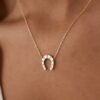 Horseshoe pendant necklace with a simple good-luck design
