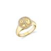 Small disc signet ring with a tricon motif
