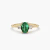 Three-stone ring with CZ emerald and diamond accents