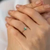 Sterling silver ring with emerald CZ and diamond-style accents