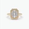 Emerald cut solitaire engagement ring with illusion halo sparkle