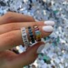 Continuous row of emerald-cut stones on a slim ring