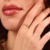 Eternity ring with vivid emerald-hued CZ stones