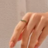 Emerald and white stones set in a modern ring design
