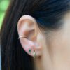 Classic stud earrings with bright green stone detail