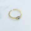 Evil eye ring with a 4.8mm ring height and slim profile