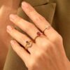 Gold-plated sterling silver ring with deep red oval stone
