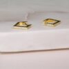 Huggie earrings measuring 14mm outer diameter and 7mm inner diameter