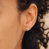 Pave-set stud earrings crafted in 925 Sterling Silver with thick gold plating
