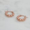 Sterling silver hoop earrings with subtle beaded detailing and plating