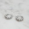 Beaded hoop earrings with a refined rounded profile and texture