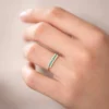Half eternity ring with square emerald green stones