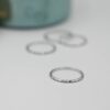 Hammered surface ring with a softly reflective finish