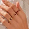 925 Sterling Silver ring with thick gold plating and garnet-coloured stone