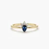 Mini ring with sapphire-hued CZ and diamond-like accents