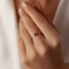 Dainty ring with a refined, balanced stone arrangement