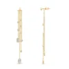 Mixed shape bezel details define this tassel earring design