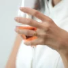 Thick gold-plated sterling silver ring with a bright orange stone