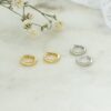 Gold-plated sterling silver huggies earrings with a simple design