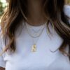 Rectangle pendant necklace with 1.75-inch floral medallion