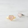 Gold-plated ring featuring a heart-shaped rose quartz design