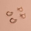 Compact huggie earrings with thick gold plating and bright CZ stones