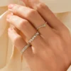 Stacking ring featuring a modern chevron shape and pave stones