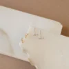 Delicate star stud earrings with polished celestial design
