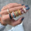 Three-quarter gemstone ring with soft, balanced sparkle
