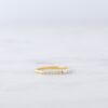 Pearl ring with three petite stones and pavé detailing