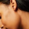 Tiny hoop earrings with a polished gold-plated finish