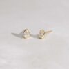 Tiny pear stud earrings with bright, diamond-like sparkle