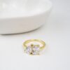 Gold-plated sterling silver ring with prong-set CZ stones