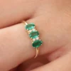 Triple oval emerald ring with balanced three-stone design